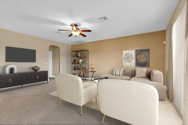 301 Wye Oak St, Austin, TX 78748 - living area with light colored carpet, a ceiling fan, and arched walkways