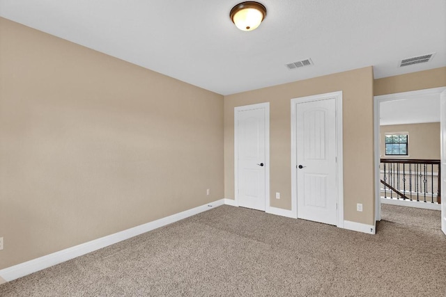 301 Wye Oak St, Austin, TX 78748 - unfurnished bedroom featuring carpet floors and two closets