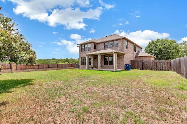 301 Wye Oak St, Austin, TX 78748 - back of property featuring brick siding, a fenced backyard, and a patio area