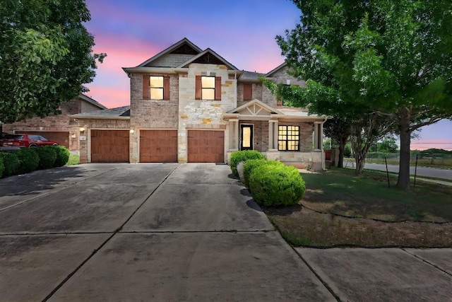 301 Wye Oak St, Austin, TX 78748 - craftsman-style house with stone siding, driveway, and an attached garage