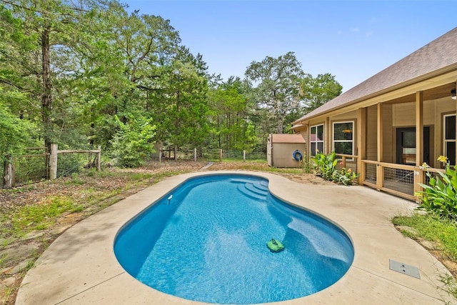 267 Corral Rd, Smithville, TX 78957 - swimming pool with a fenced backyard, a patio, and view of scattered trees