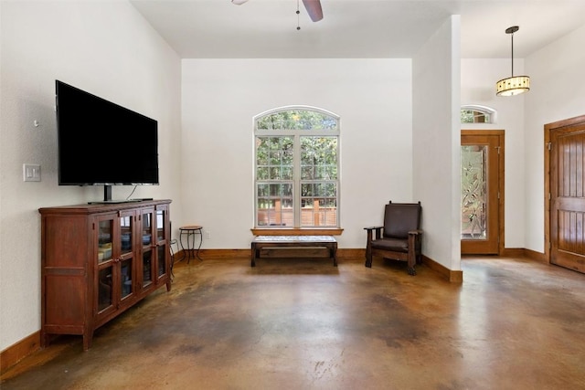 267 Corral Rd, Smithville, TX 78957 - sitting room featuring concrete flooring and a ceiling fan