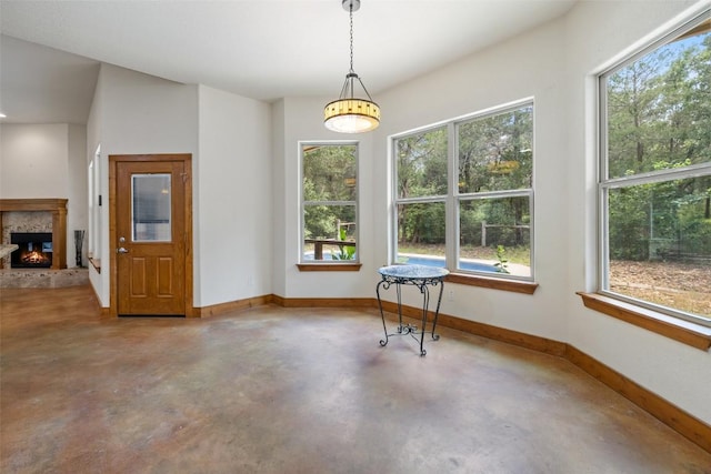 267 Corral Rd, Smithville, TX 78957 - dining area with concrete flooring, healthy amount of natural light, and a lit fireplace