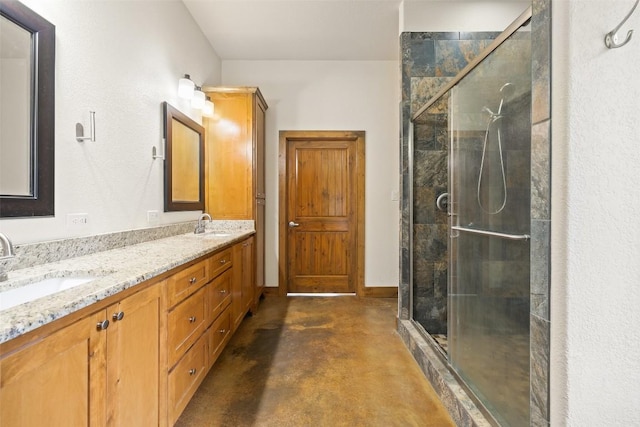 267 Corral Rd, Smithville, TX 78957 - full bathroom featuring a stall shower, double vanity, and finished concrete floors