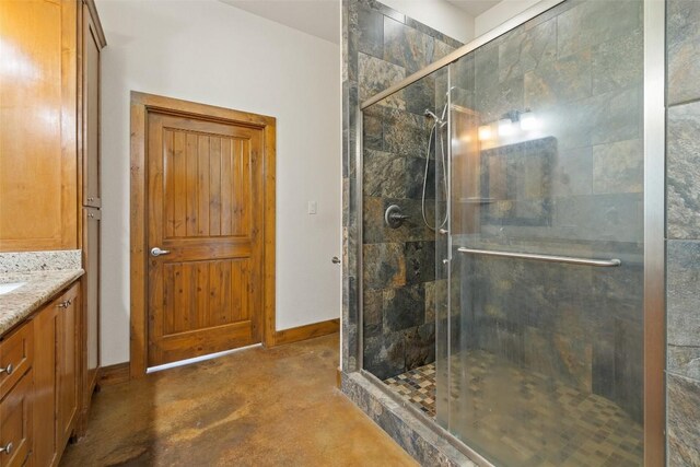 267 Corral Rd, Smithville, TX 78957 - full bath featuring a shower stall, concrete flooring, and vanity