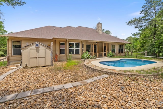 267 Corral Rd, Smithville, TX 78957 - swimming pool featuring a storage unit, ceiling fan, and a sunroom