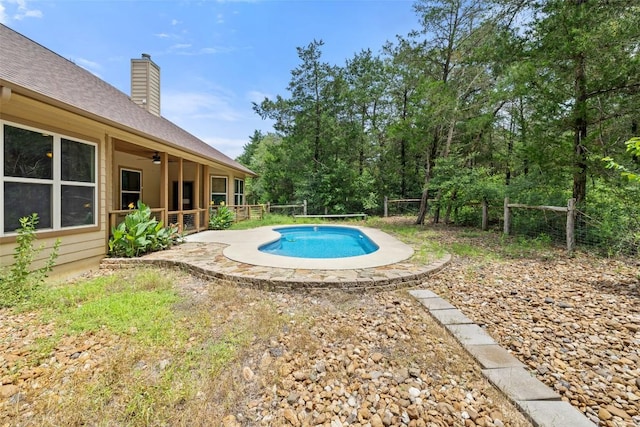 267 Corral Rd, Smithville, TX 78957 - swimming pool with a ceiling fan and a patio