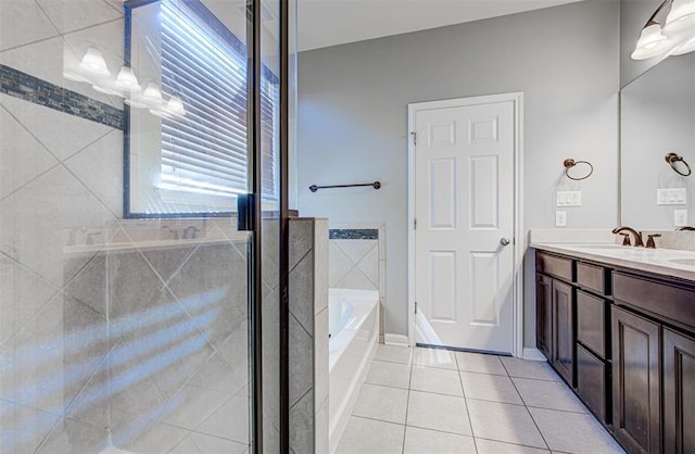 2836 Garnet Ridge Dr, Leander, TX 78641 - bathroom featuring a garden tub, double vanity, tile patterned floors, and a shower stall