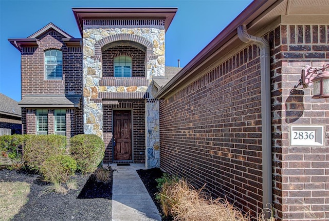 2836 Garnet Ridge Dr, Leander, TX 78641 - doorway to property featuring brick siding