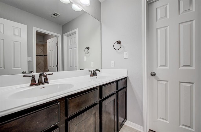 2836 Garnet Ridge Dr, Leander, TX 78641 - bathroom featuring double vanity and baseboards