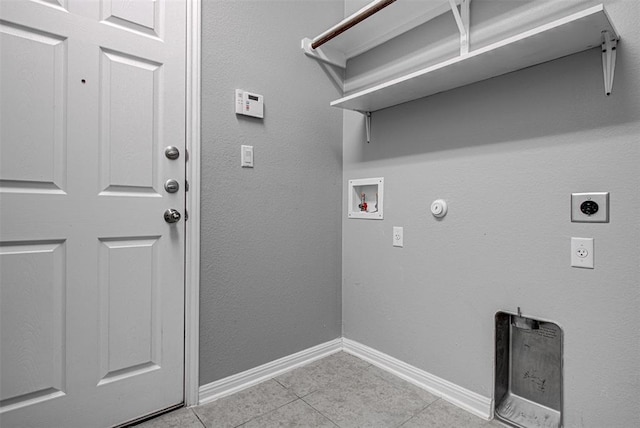 2836 Garnet Ridge Dr, Leander, TX 78641 - laundry area with electric dryer hookup, light tile patterned flooring, washer hookup, and hookup for a gas dryer
