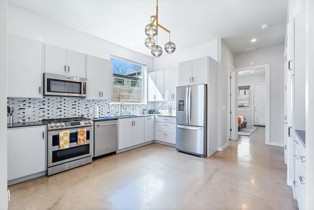 4314 Jinx Ave Unit A, Austin, TX 78745 - kitchen featuring stainless steel appliances, decorative backsplash, concrete floors, decorative light fixtures, and recessed lighting