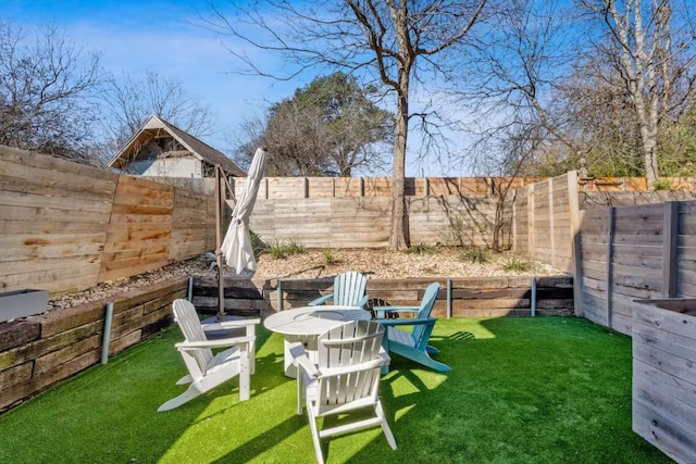 4314 Jinx Ave Unit A, Austin, TX 78745 - fenced backyard with a fire pit