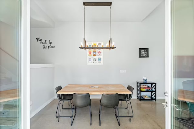 4314 Jinx Ave Unit A, Austin, TX 78745 - dining space featuring finished concrete flooring and a chandelier