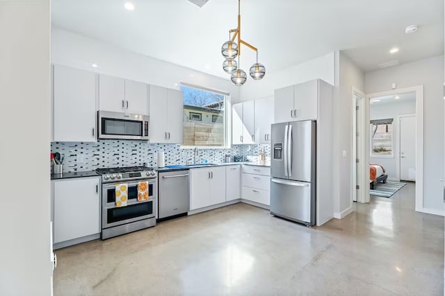 4314 Jinx Ave Unit A, Austin, TX 78745 - kitchen featuring stainless steel appliances, concrete flooring, tasteful backsplash, pendant lighting, and white cabinets