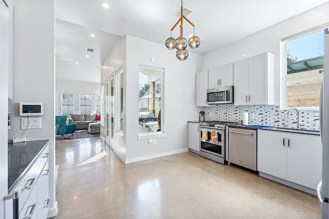 4314 Jinx Ave Unit A, Austin, TX 78745 - kitchen with appliances with stainless steel finishes, dark countertops, backsplash, concrete flooring, and white cabinets