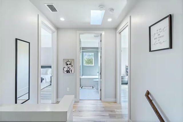 4314 Jinx Ave Unit A, Austin, TX 78745 - hall with an upstairs landing, light wood-style flooring, and recessed lighting