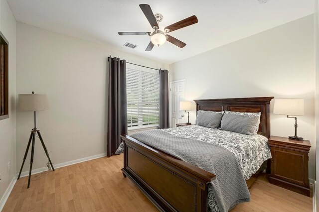 19709 Vilamoura St, Pflugerville, TX 78660 - bedroom with light wood-style floors and ceiling fan