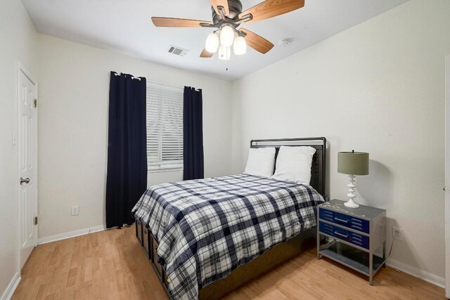 19709 Vilamoura St, Pflugerville, TX 78660 - bedroom with light wood-style floors and ceiling fan