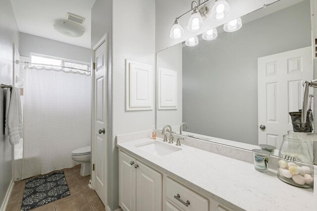 19709 Vilamoura St, Pflugerville, TX 78660 - bathroom with vanity, tile patterned flooring, and shower / tub combo with curtain