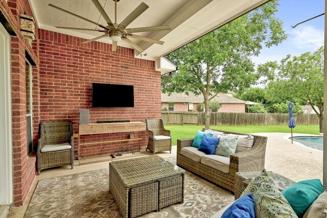 19709 Vilamoura St, Pflugerville, TX 78660 - fenced backyard featuring a ceiling fan, outdoor lounge area, and a patio