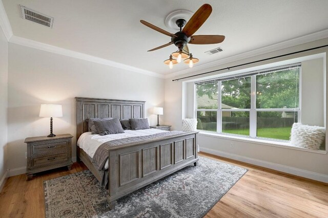 19709 Vilamoura St, Pflugerville, TX 78660 - bedroom with ornamental molding, light wood-style floors, and ceiling fan
