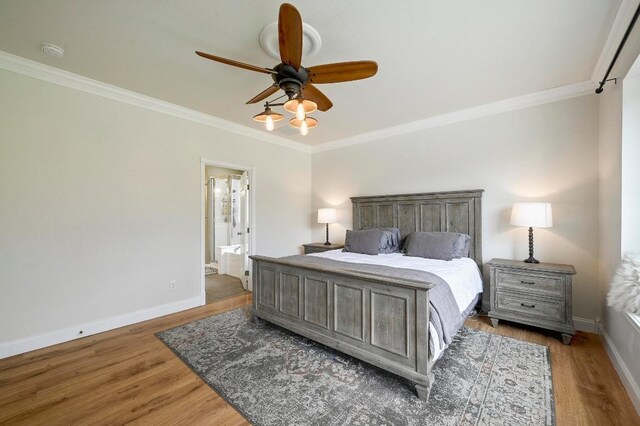 19709 Vilamoura St, Pflugerville, TX 78660 - bedroom featuring crown molding, wood finished floors, ensuite bathroom, and ceiling fan