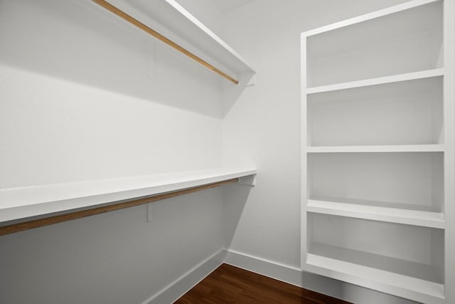 147 Kahana Ln, Bastrop, TX 78602 - spacious closet featuring dark wood-type flooring