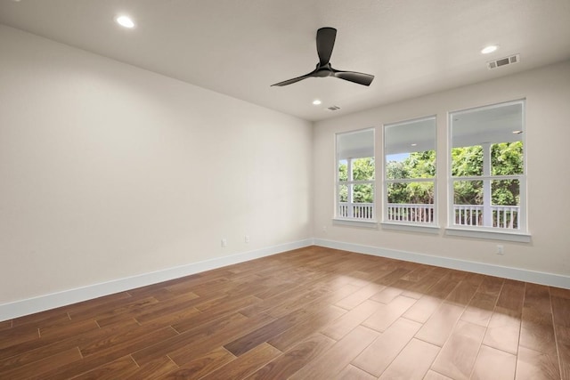 147 Kahana Ln, Bastrop, TX 78602 - unfurnished room with wood finished floors, a ceiling fan, and recessed lighting