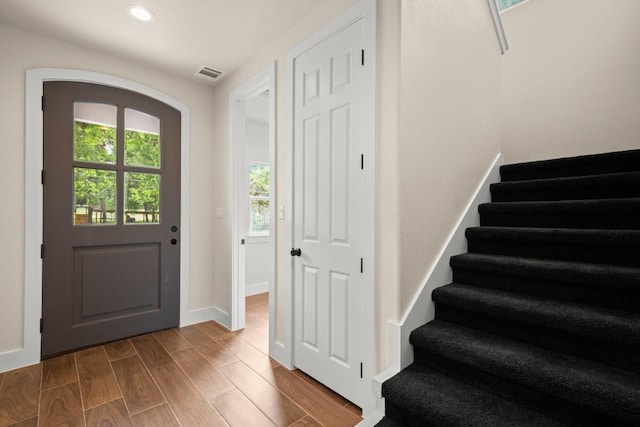 147 Kahana Ln, Bastrop, TX 78602 - entryway featuring stairs, recessed lighting, and wood finished floors
