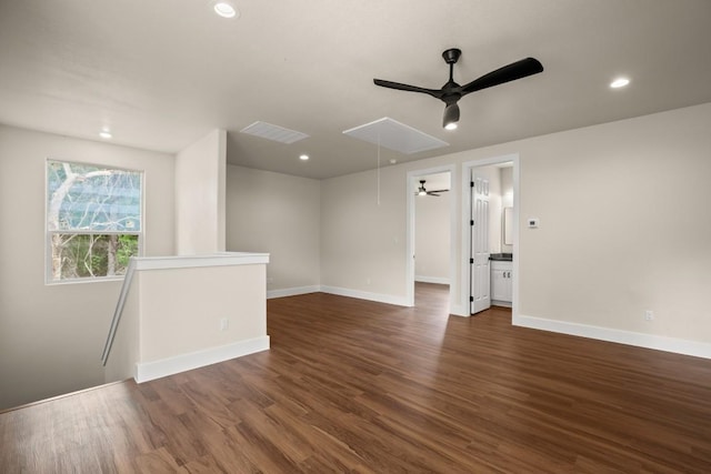 147 Kahana Ln, Bastrop, TX 78602 - spare room featuring attic access, a ceiling fan, dark wood-style flooring, and recessed lighting