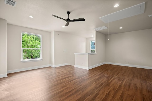 147 Kahana Ln, Bastrop, TX 78602 - unfurnished room featuring attic access, healthy amount of natural light, wood finished floors, ceiling fan, and recessed lighting