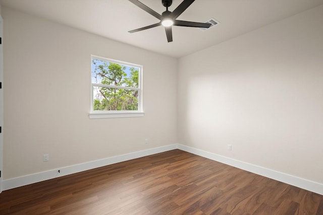 147 Kahana Ln, Bastrop, TX 78602 - unfurnished room featuring a ceiling fan and dark wood-type flooring
