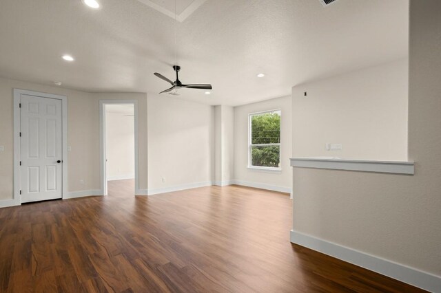 147 Kahana Ln, Bastrop, TX 78602 - unfurnished living room featuring recessed lighting, wood finished floors, and ceiling fan