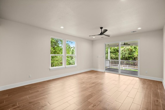 147 Kahana Ln, Bastrop, TX 78602 - unfurnished room with ceiling fan, plenty of natural light, wood finished floors, and recessed lighting