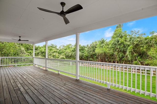 147 Kahana Ln, Bastrop, TX 78602 - deck with ceiling fan, a yard, and view of wooded area