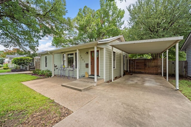 1807 Cullen Ave, Austin, TX 78757 - view of front of house featuring concrete driveway and a carport