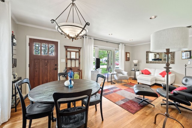1807 Cullen Ave, Austin, TX 78757 - dining area with light wood-style floors, crown molding, and recessed lighting