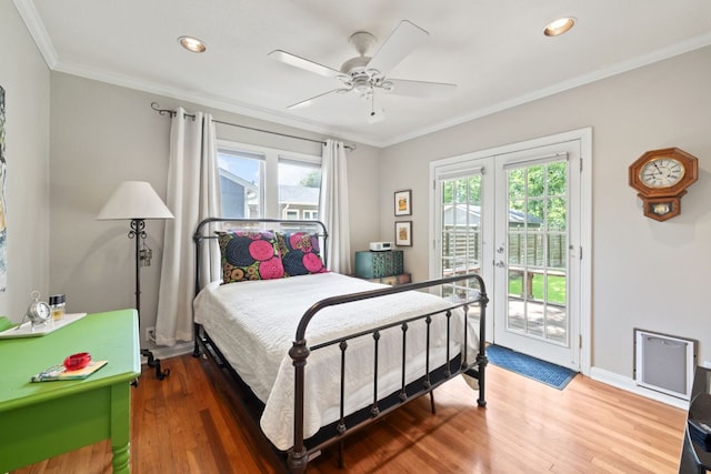 1807 Cullen Ave, Austin, TX 78757 - bedroom featuring multiple windows, access to outside, wood finished floors, crown molding, and recessed lighting