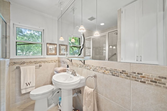 1807 Cullen Ave, Austin, TX 78757 - full bath with crown molding, a shower stall, and tile patterned floors