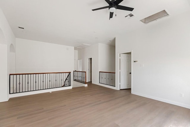 811 Zappa Dr, Cedar Park, TX 78613 - unfurnished room featuring ceiling fan, light wood-type flooring, attic access, and arched walkways