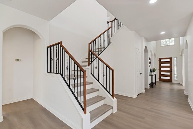 811 Zappa Dr, Cedar Park, TX 78613 - stairway featuring arched walkways, wood finished floors, and recessed lighting
