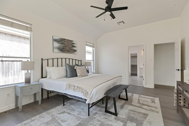 811 Zappa Dr, Cedar Park, TX 78613 - bedroom with wood finished floors, vaulted ceiling, a walk in closet, and ceiling fan