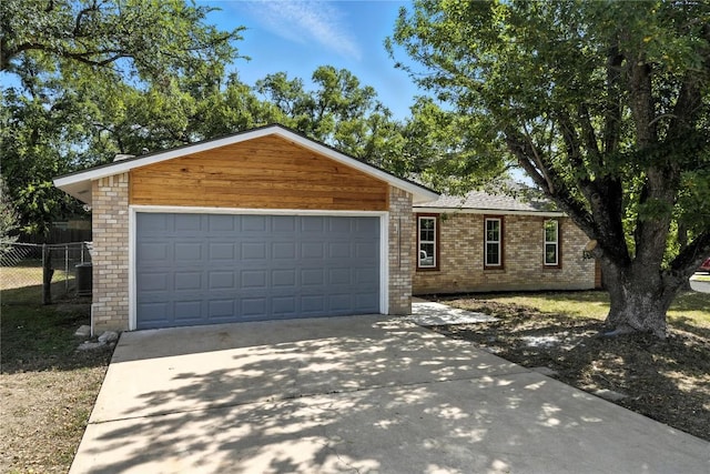 2400 Burly Oak Dr, Austin, TX 78745 - view of front of property featuring driveway, a garage, and brick siding