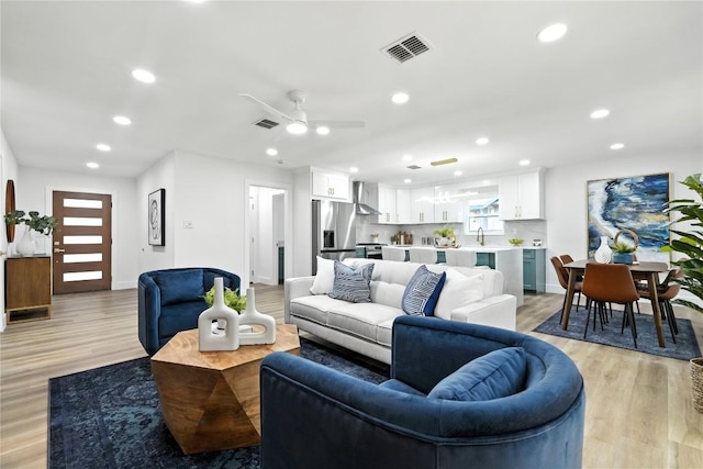 2400 Burly Oak Dr, Austin, TX 78745 - living room with light wood finished floors, recessed lighting, and ceiling fan