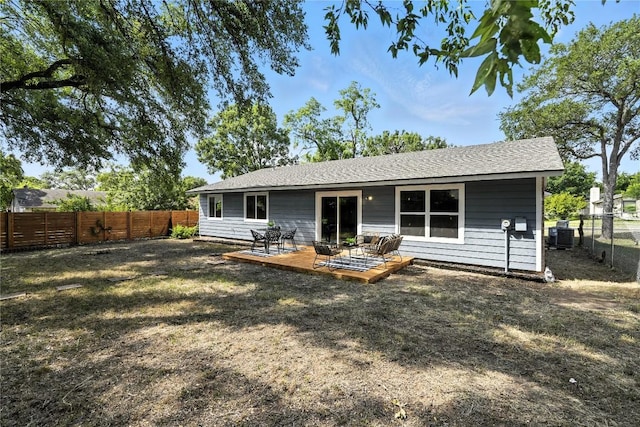 2400 Burly Oak Dr, Austin, TX 78745 - back of property with a fenced backyard and a deck