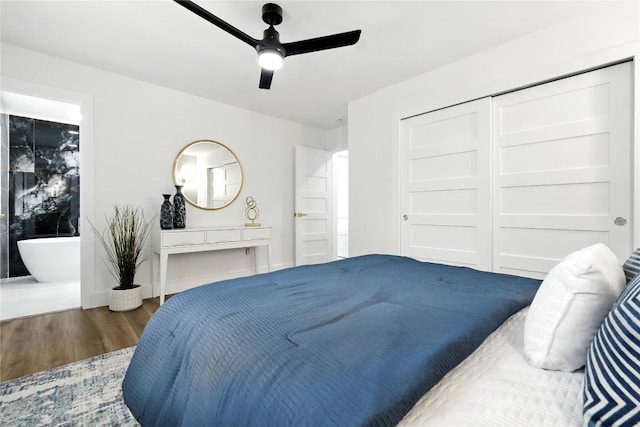 2400 Burly Oak Dr, Austin, TX 78745 - bedroom featuring wood finished floors, a ceiling fan, and a closet