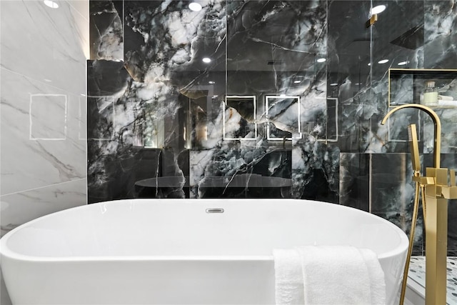 2400 Burly Oak Dr, Austin, TX 78745 - full bath with a freestanding tub, tile walls, and a shower