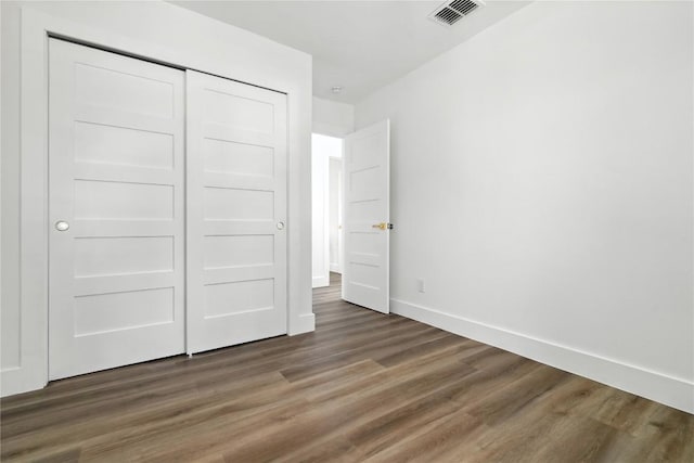 2400 Burly Oak Dr, Austin, TX 78745 - unfurnished bedroom with wood finished floors and a closet
