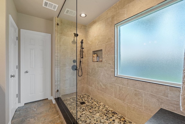 2634 Plantation Dr, Round Rock, TX 78681 - bathroom featuring a walk in shower and stone finish floors